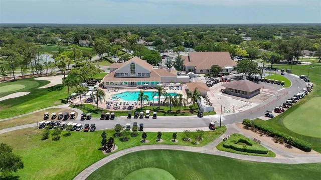 a view of a house with a yard and sitting area