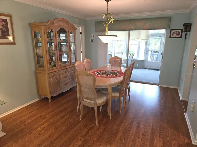 a dining room with furniture window wooden floor