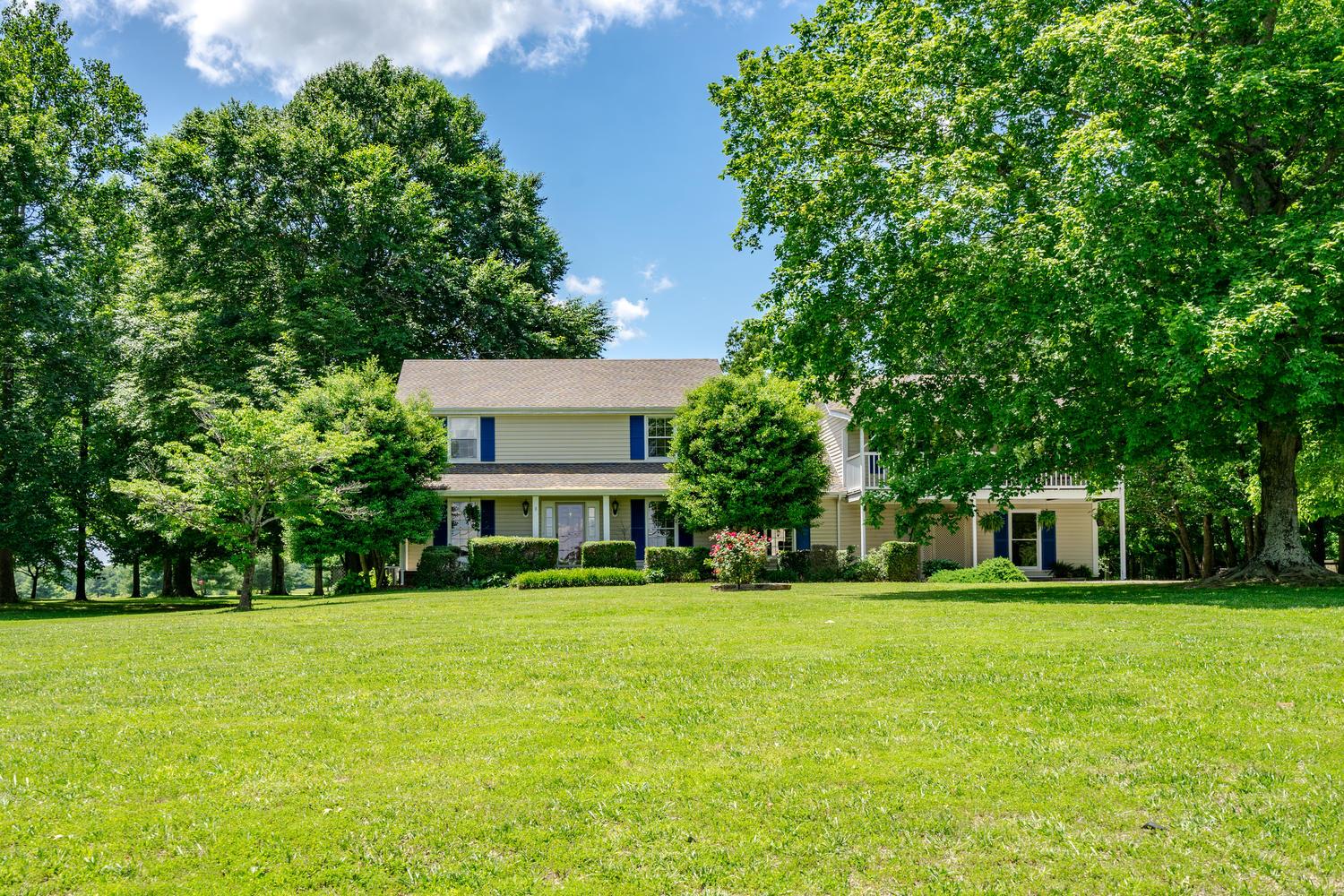4650 Sango Road Clarksville, TN 37043 - Photo 8 of 30 a view of house with a big yard and large trees