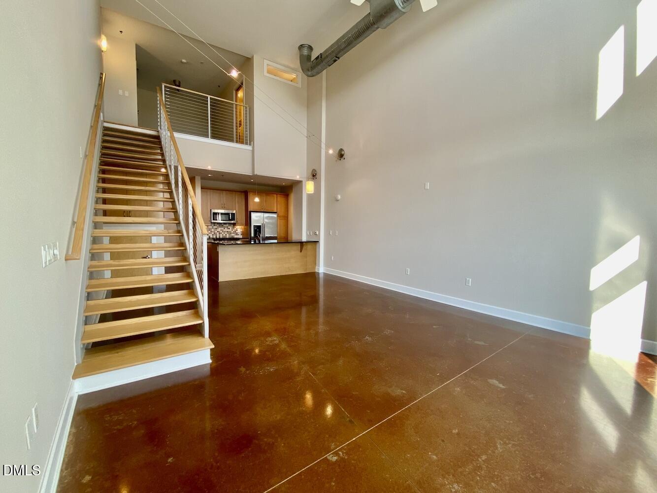 2608 Erwin Road, Unit 428 Durham, NC 27705 - Photo 11 of 33 a view of a room with stairs and a rug