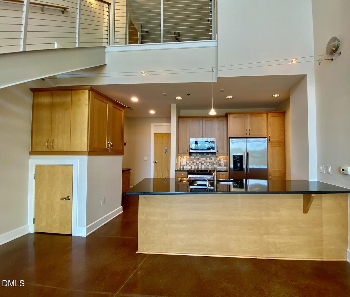 2608 Erwin Road, Unit 428 Durham, NC 27705 - Photo 7 of 33 a view of kitchen with stainless steel appliances granite countertop sink and cabinets