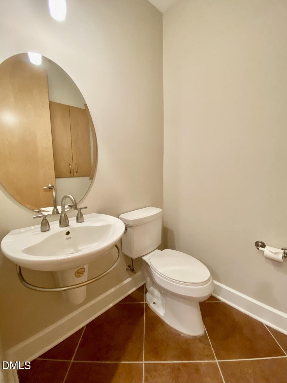 2608 Erwin Road, Unit 428 Durham, NC 27705 - Photo 9 of 33 a bathroom with a sink toilet and mirror