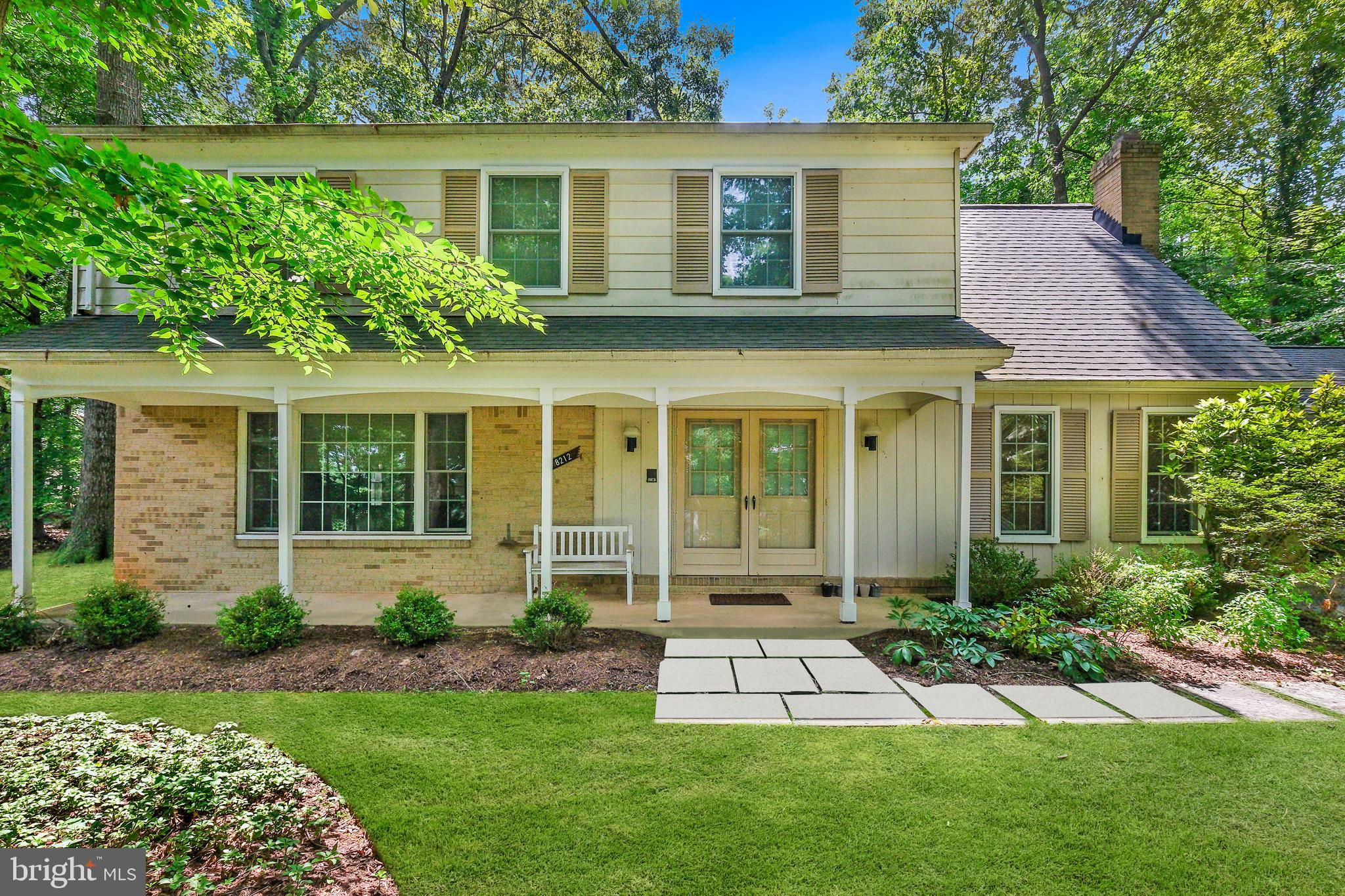 a view of a house with a yard and plants