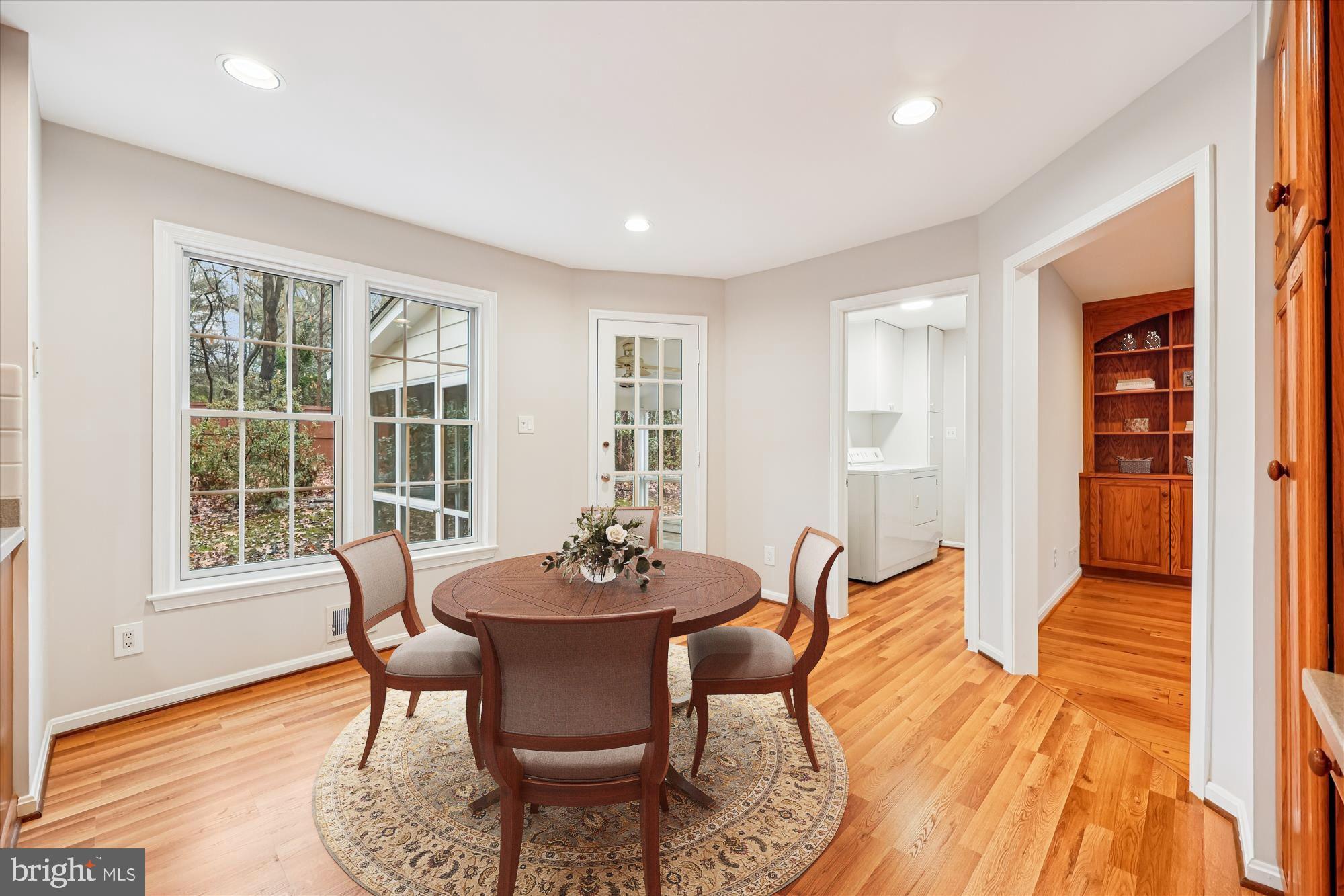 8212 Killean Way Potomac, MD 20854 - Photo 14 of 51 a view of a dining room with furniture and wooden floor