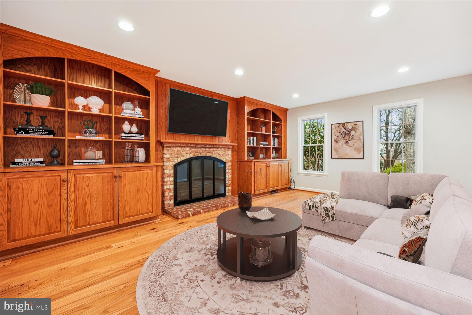 8212 Killean Way Potomac, MD 20854 - Photo 16 of 51 a living room with furniture and a fireplace