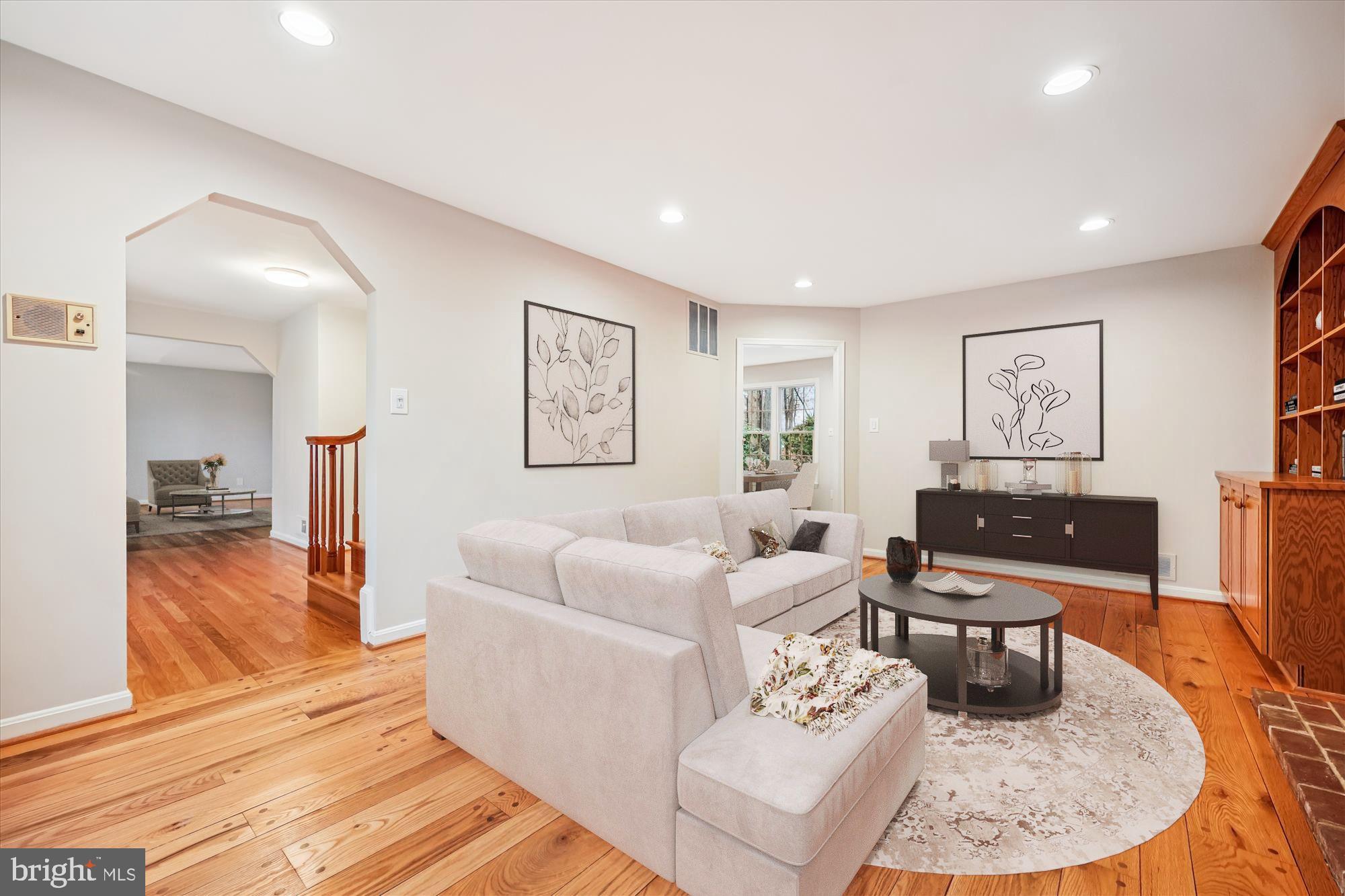 8212 Killean Way Potomac, MD 20854 - Photo 17 of 51 a living room with furniture and a wooden floor