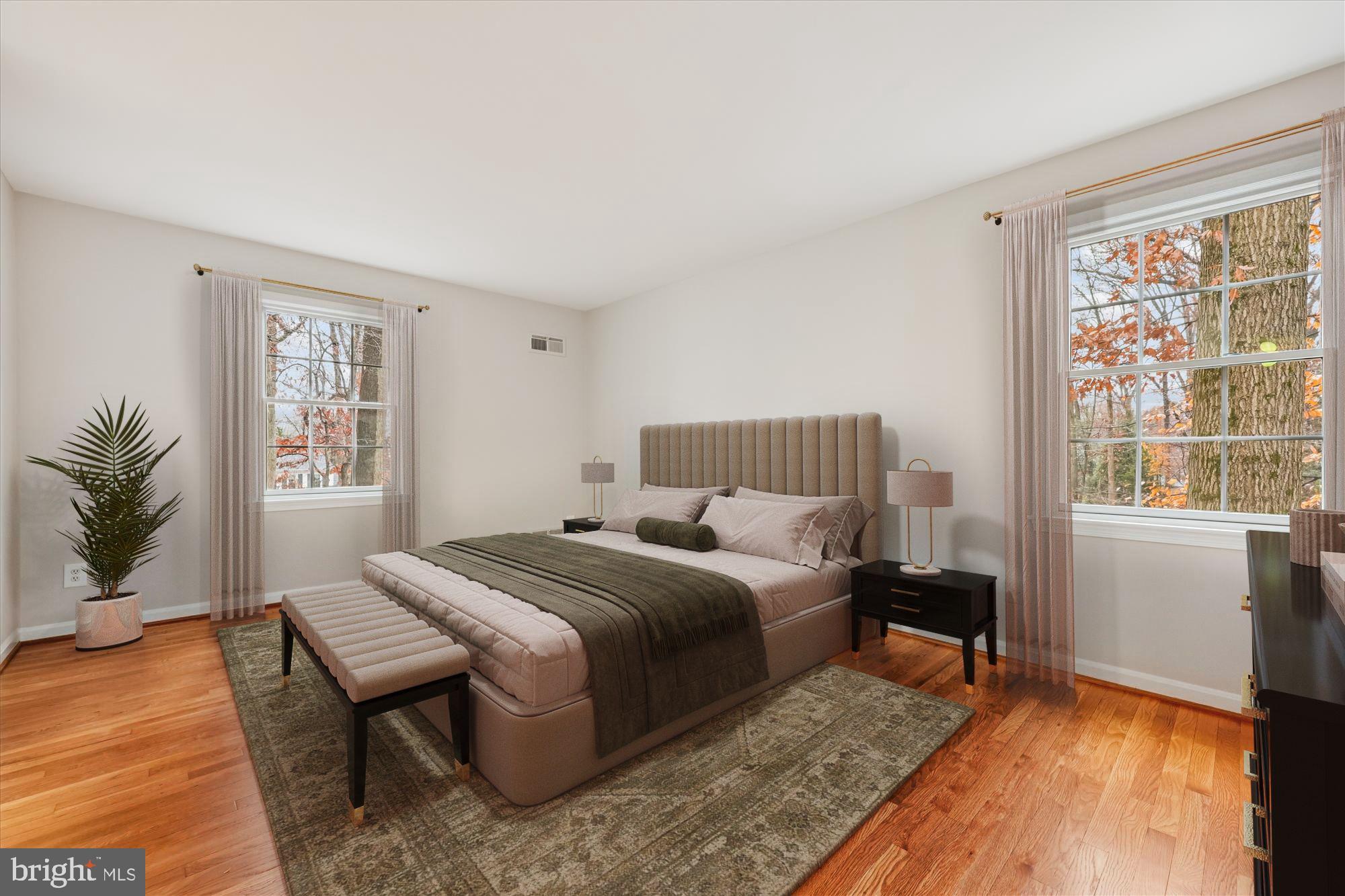 8212 Killean Way Potomac, MD 20854 - Photo 22 of 51 a bedroom with a bed and wooden floor