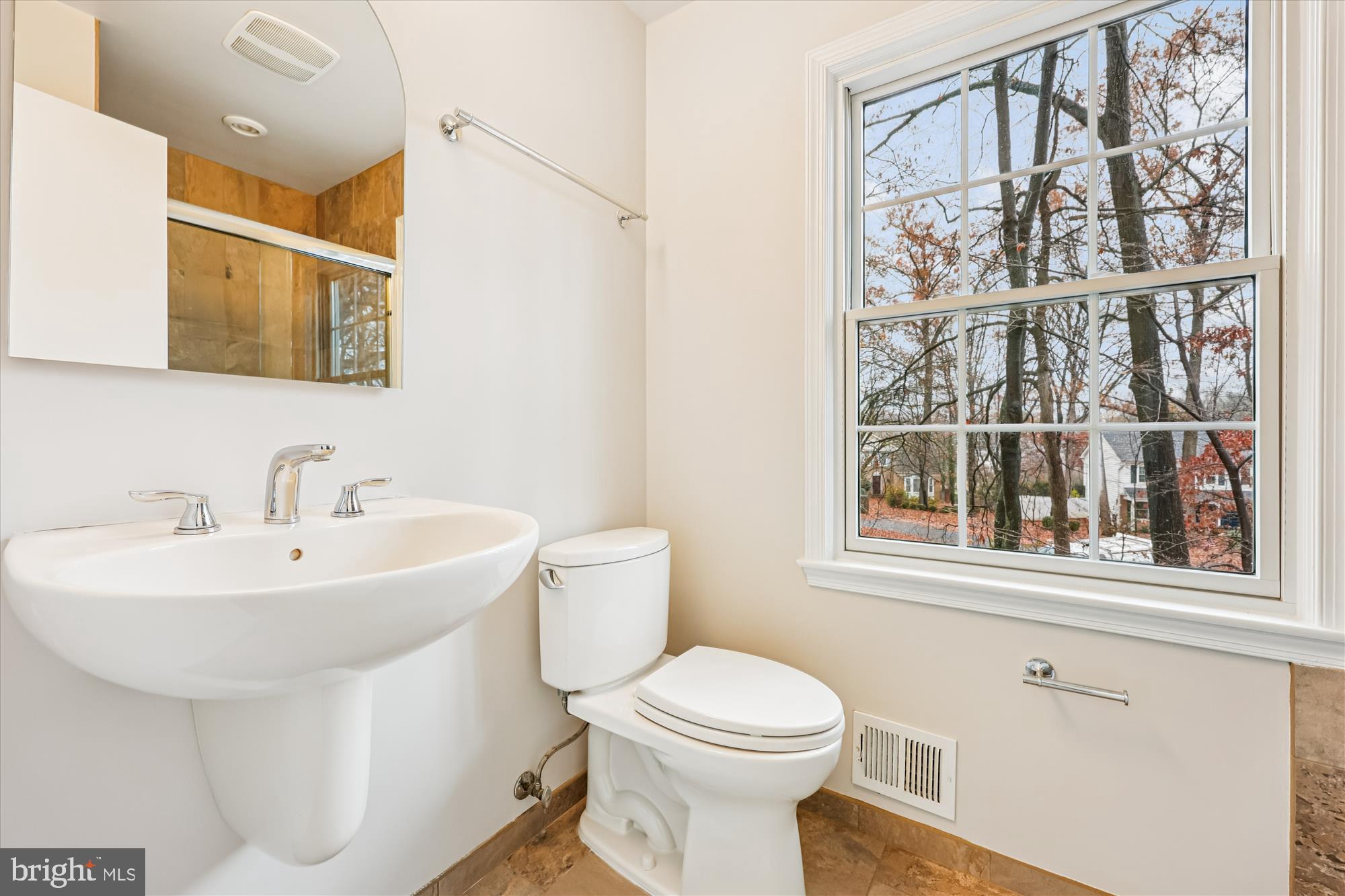 8212 Killean Way Potomac, MD 20854 - Photo 26 of 51 a white toilet sitting next to a bathroom sink