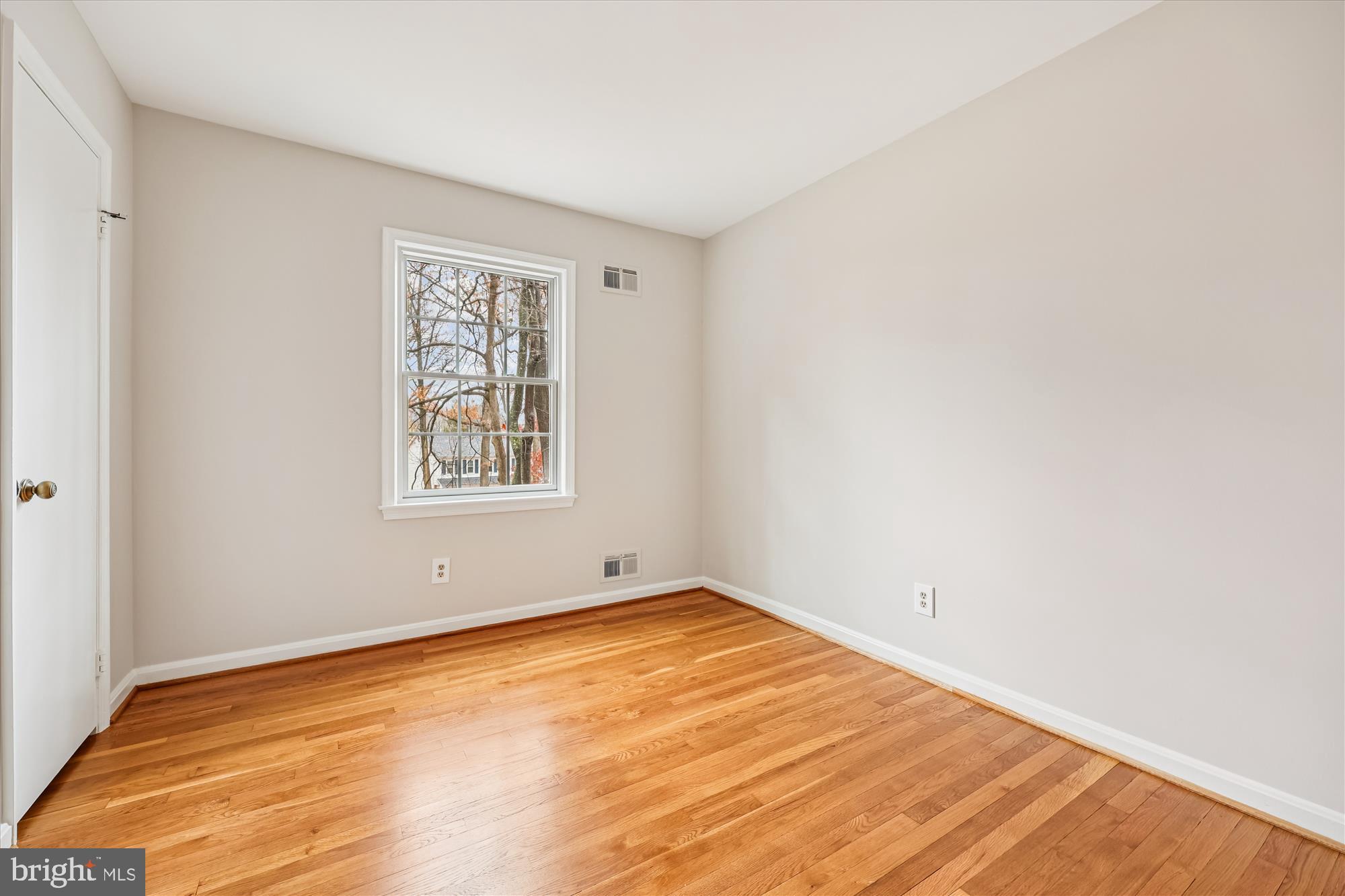8212 Killean Way Potomac, MD 20854 - Photo 30 of 51 a view of an empty room with wooden floor and a window