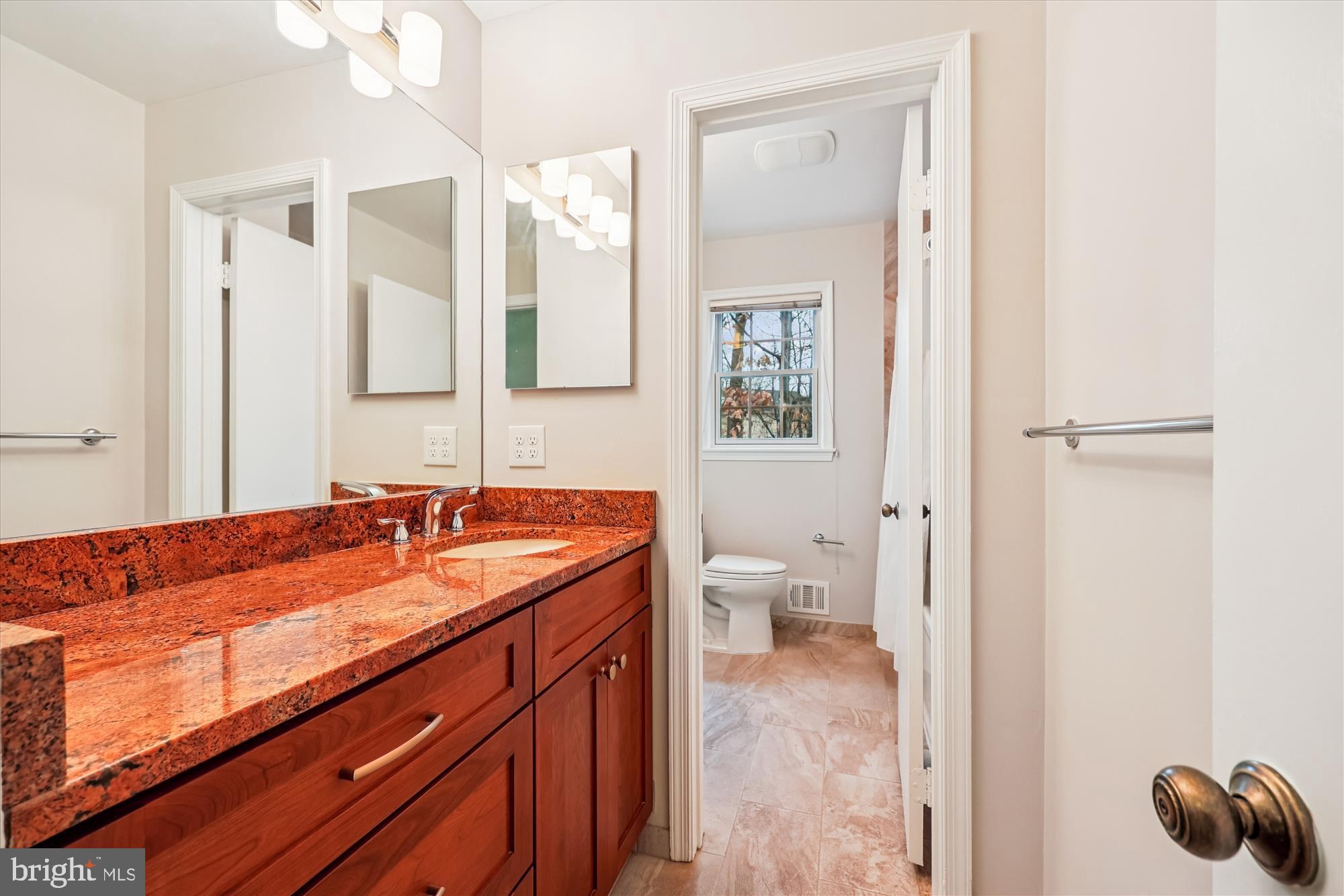8212 Killean Way Potomac, MD 20854 - Photo 32 of 51 a bathroom with a granite countertop sink and a mirror