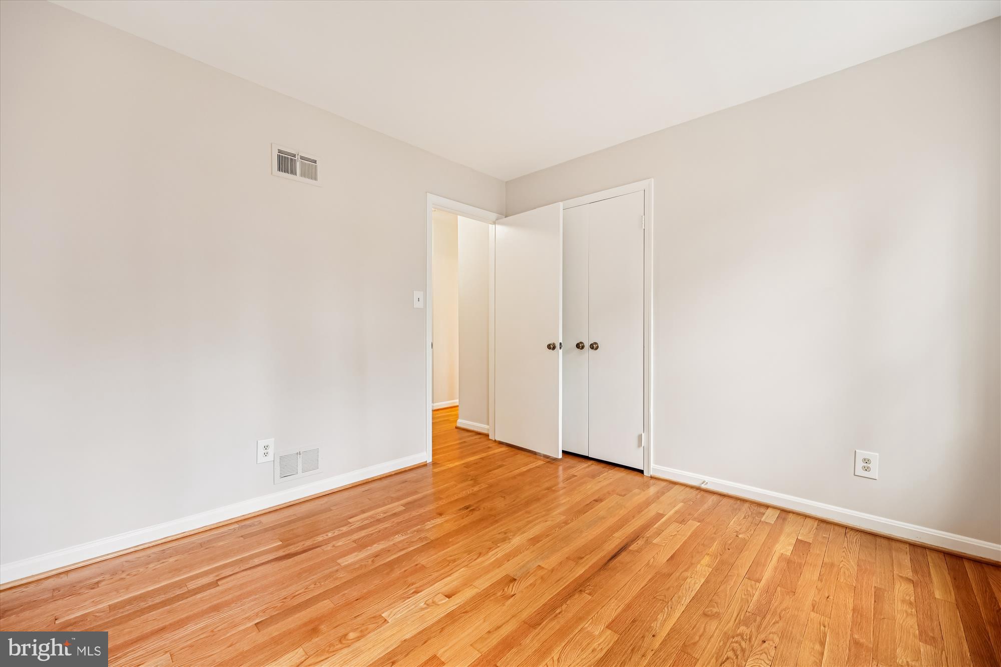 8212 Killean Way Potomac, MD 20854 - Photo 38 of 51 a view of empty room with wooden floor