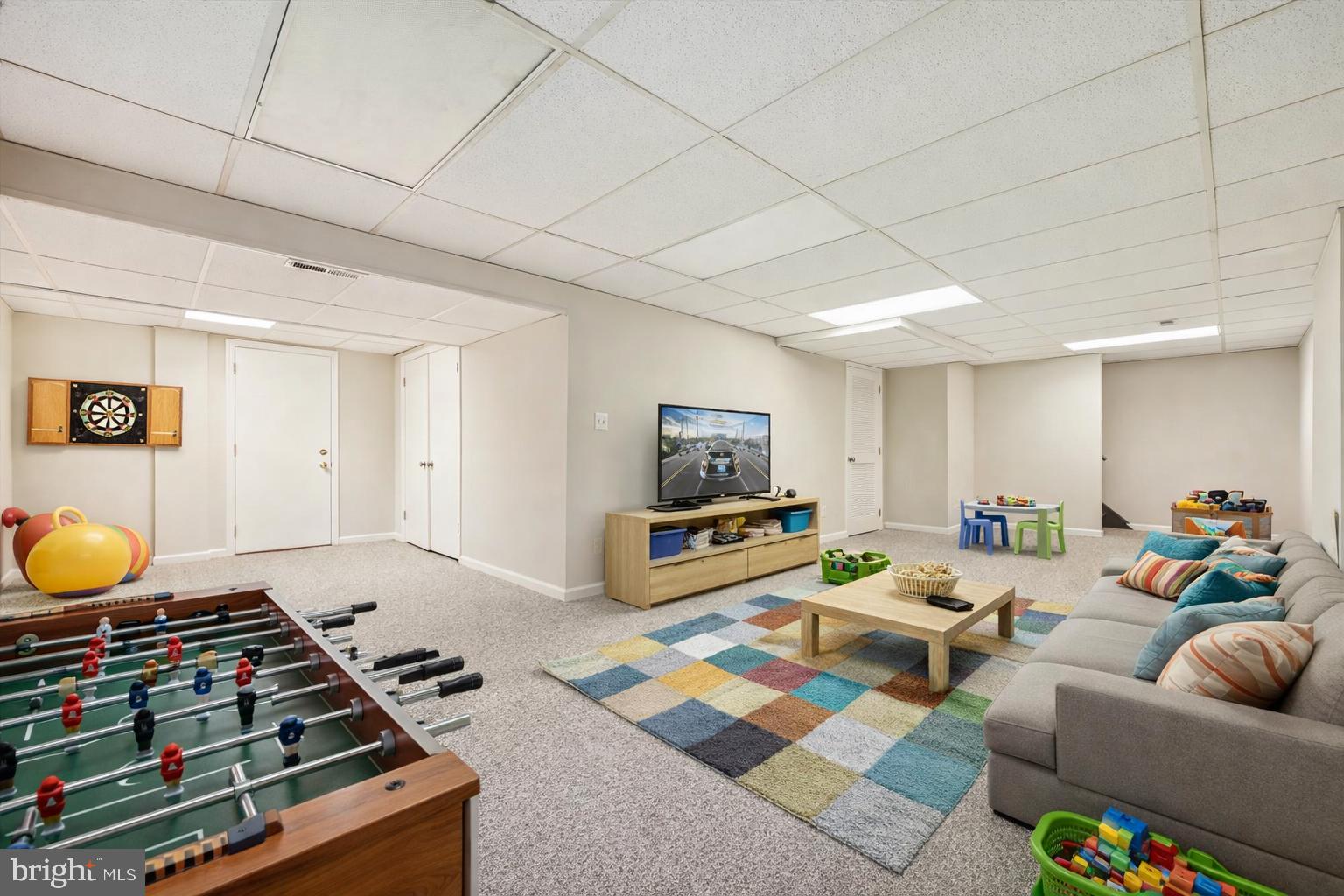 8212 Killean Way Potomac, MD 20854 - Photo 39 of 51 a living room with furniture and a flat screen tv