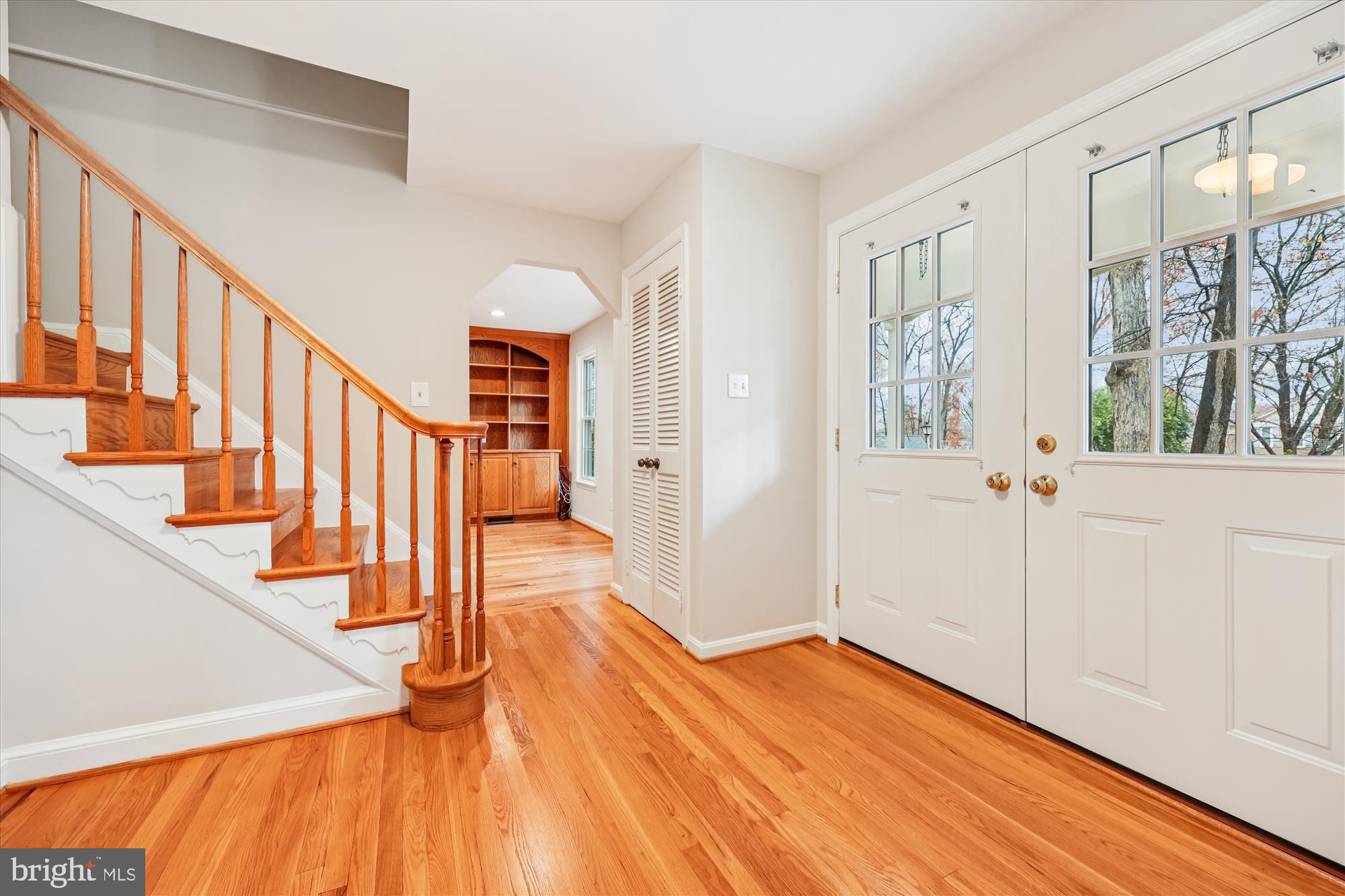 8212 Killean Way Potomac, MD 20854 - Photo 4 of 51 a view of an entryway with wooden floor and door