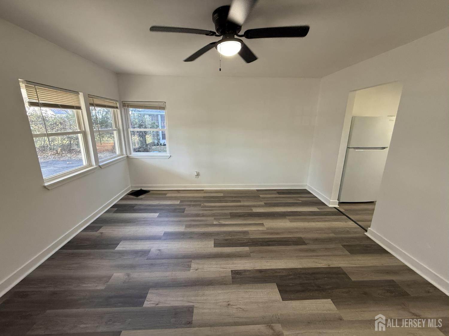 1060 Terrace Boulevard Ewing, NJ 08618 - Photo 2 of 15 a view of empty room with wooden floor and fan