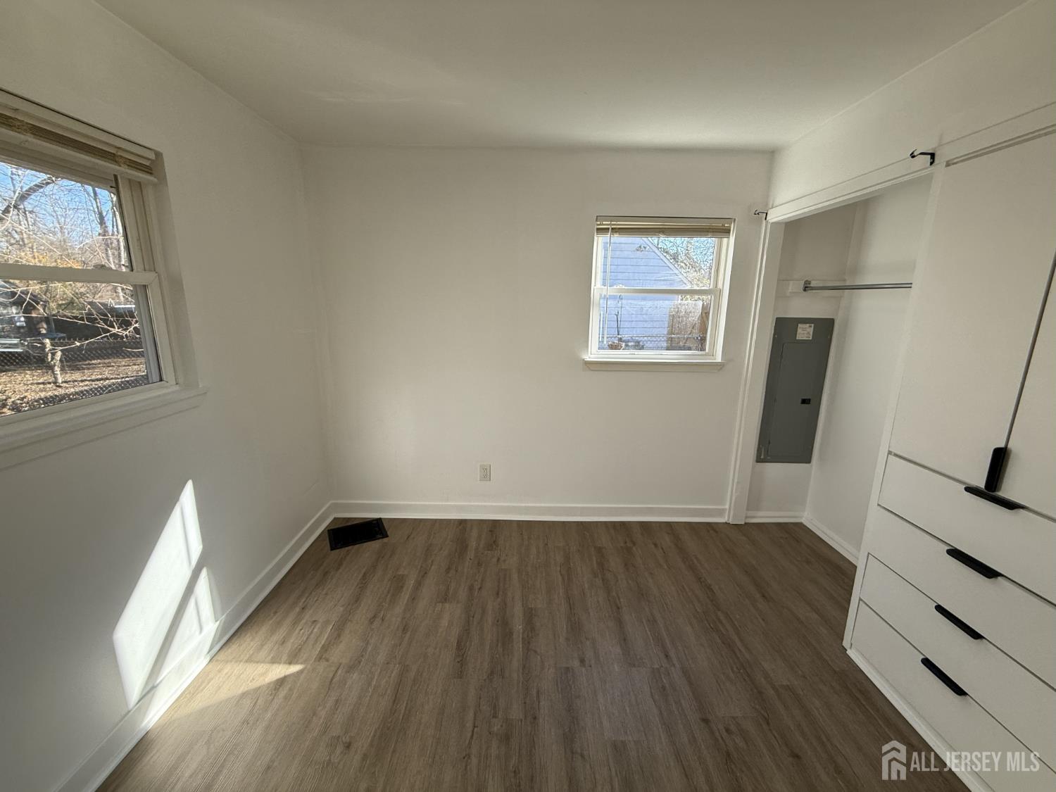 1060 Terrace Boulevard Ewing, NJ 08618 - Photo 6 of 15 wooden floor in an empty room with a window