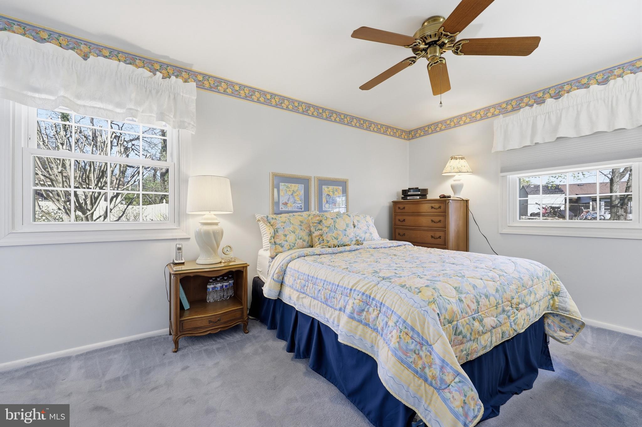 12709 Castleleigh Court Silver Spring, MD 20904 - Photo 23 of 38 a bedroom with a bed a ceiling fan and a window