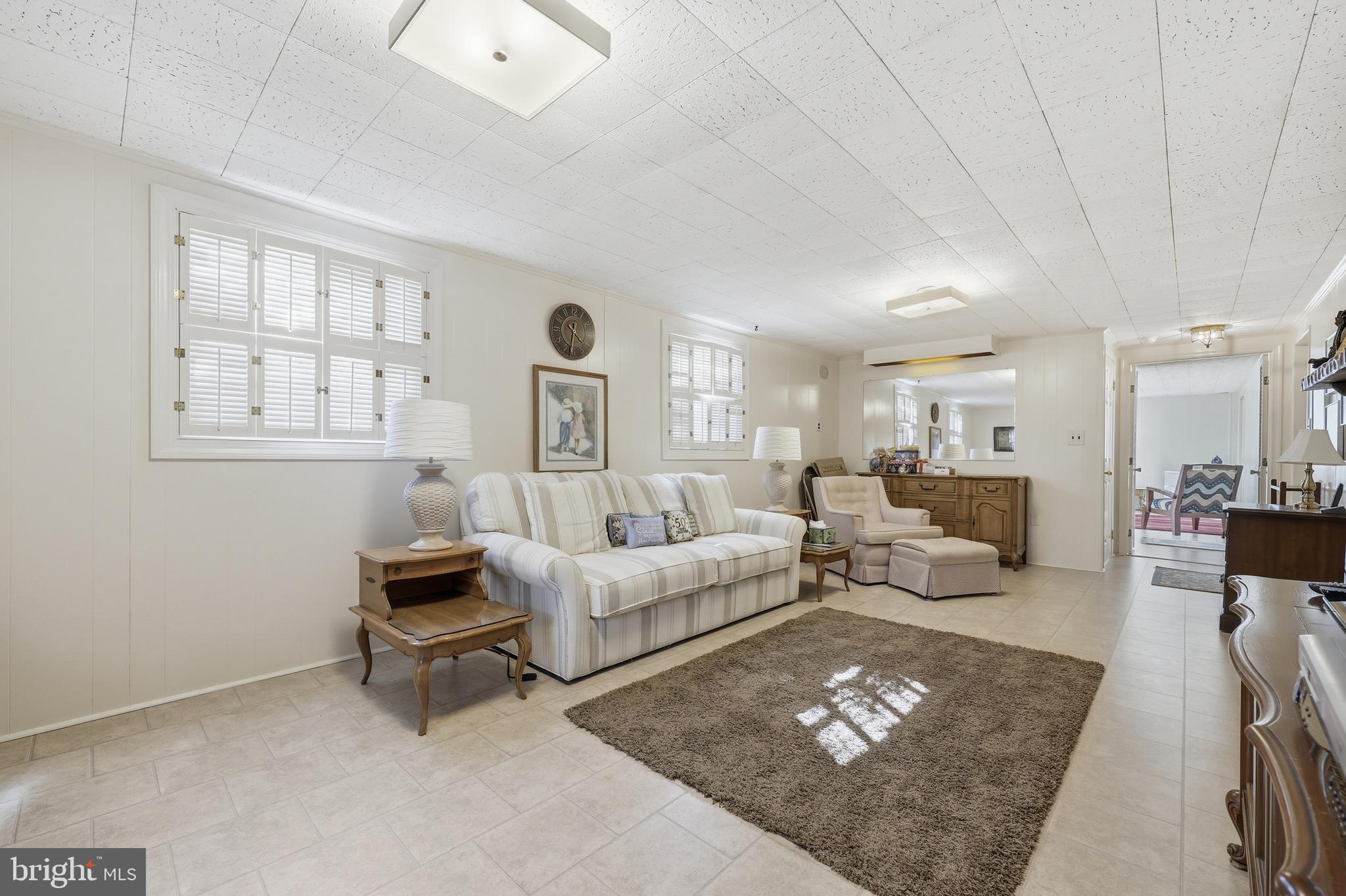 12709 Castleleigh Court Silver Spring, MD 20904 - Photo 31 of 38 a living room with furniture and a table