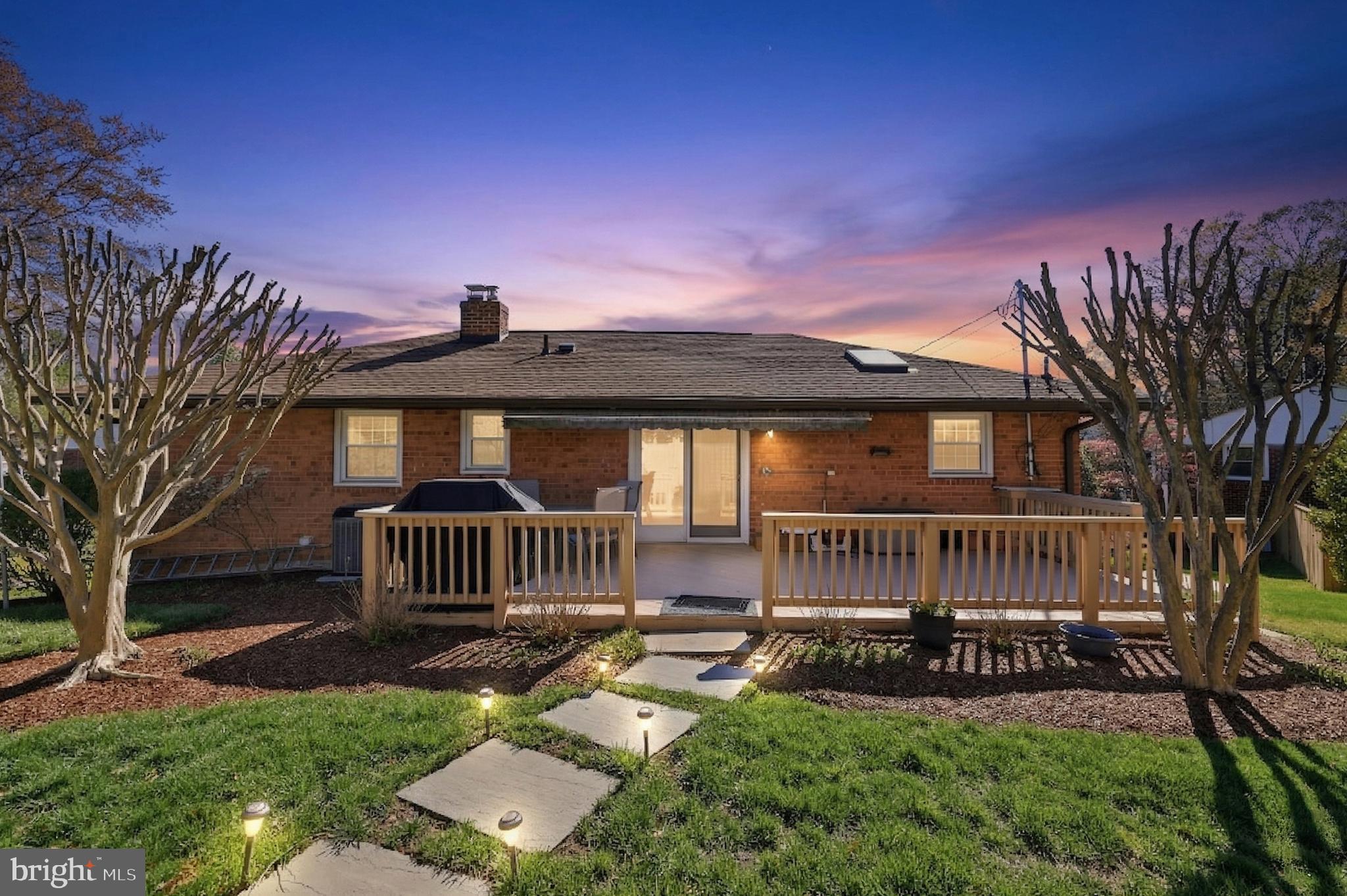 12709 Castleleigh Court Silver Spring, MD 20904 - Photo 35 of 38 a front view of a house with a garden