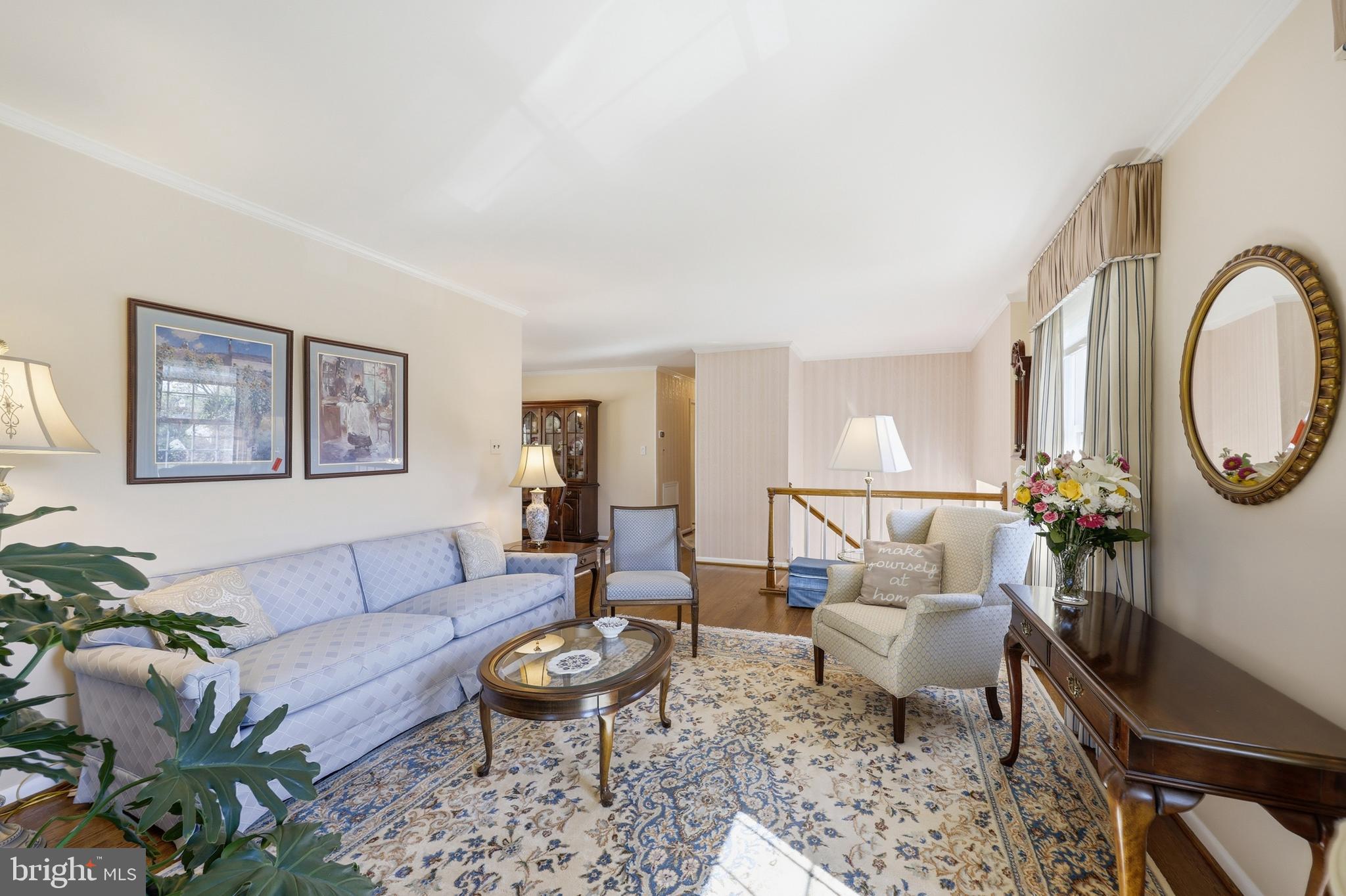 12709 Castleleigh Court Silver Spring, MD 20904 - Photo 6 of 38 a living room with furniture a rug and a lamp