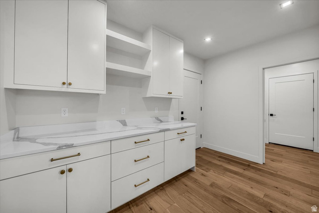 2152 South 30 West Orem, UT 84058 - Photo 17 of 56 Kitchen featuring open shelves, light wood-type flooring, white cabinetry, light stone countertops, and recessed lighting