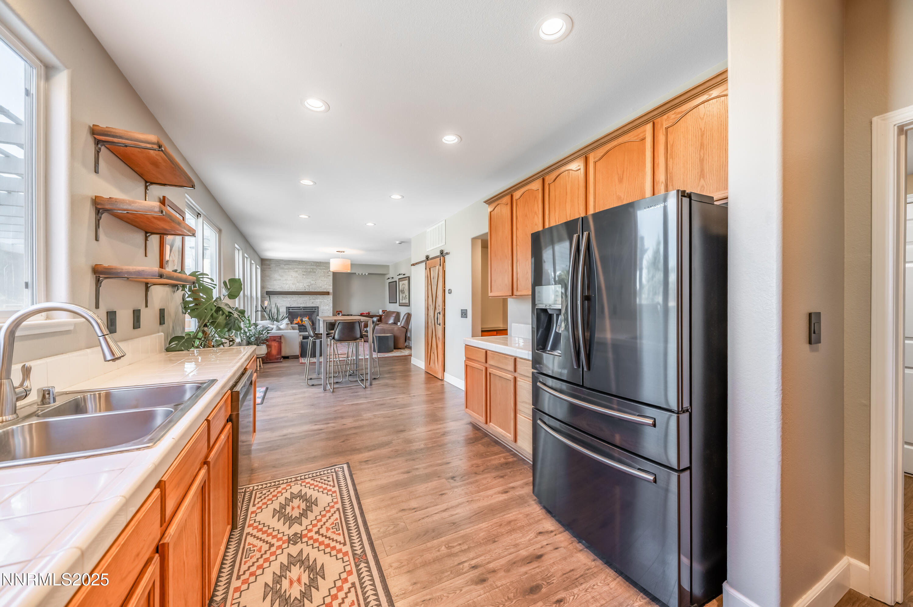 1770 Kodiak Circle Reno, NV 89511 - Photo 11 of 29 a kitchen with stainless steel appliances granite countertop a refrigerator and a sink