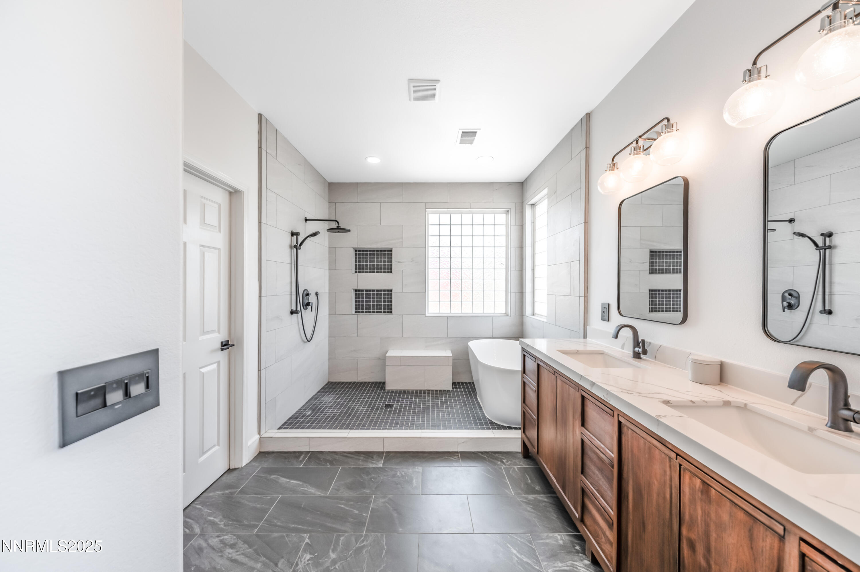 1770 Kodiak Circle Reno, NV 89511 - Photo 17 of 29 a large bathroom with a double vanity sink a large mirror and a shower