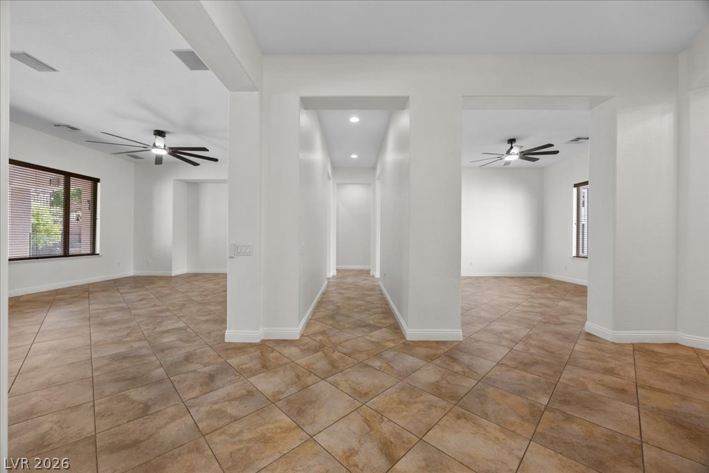 2125 De Rouge Avenue Henderson, NV 89044 - Photo 6 of 96 Clean lines and tiled floors create an open and airy interior, ready for your personal touch.