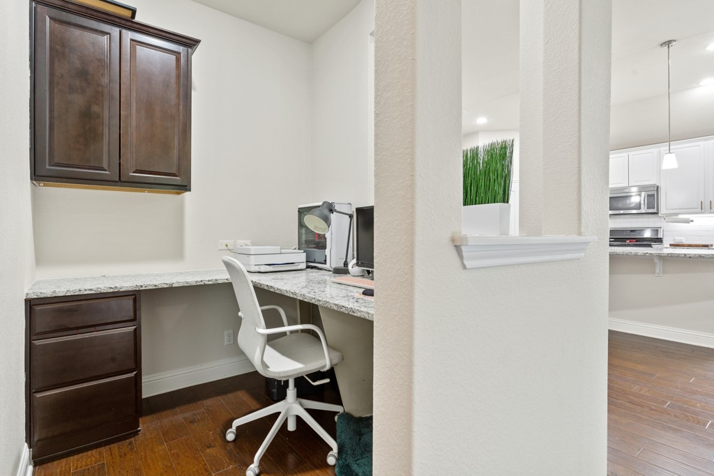 1916 Elaina Loop Leander, TX 78641 - Photo 13 of 23 a view of a workspace with furniture and a window