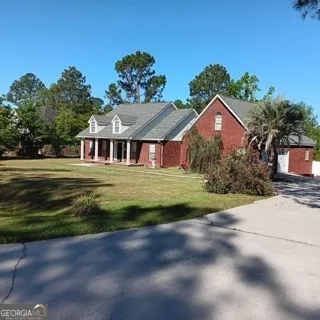 a view of a room with wooden floor and stairs