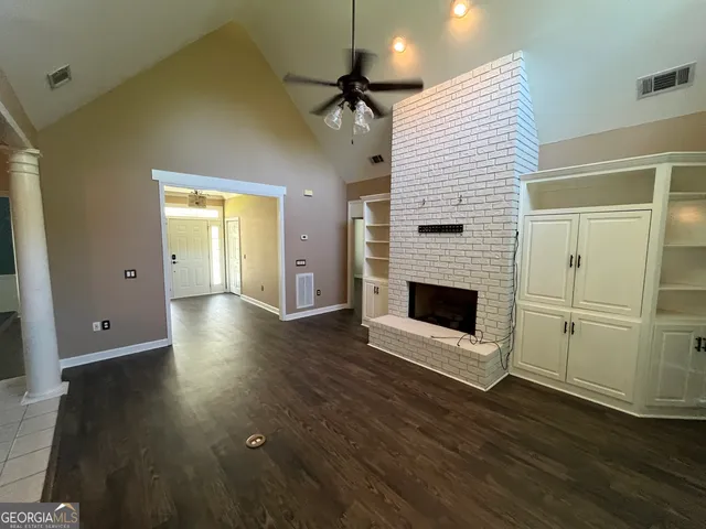 a bathroom with a shower and a toilet