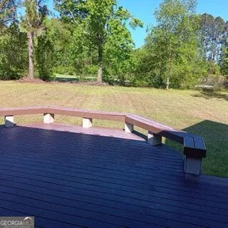 a front view of a house with a yard and a garage