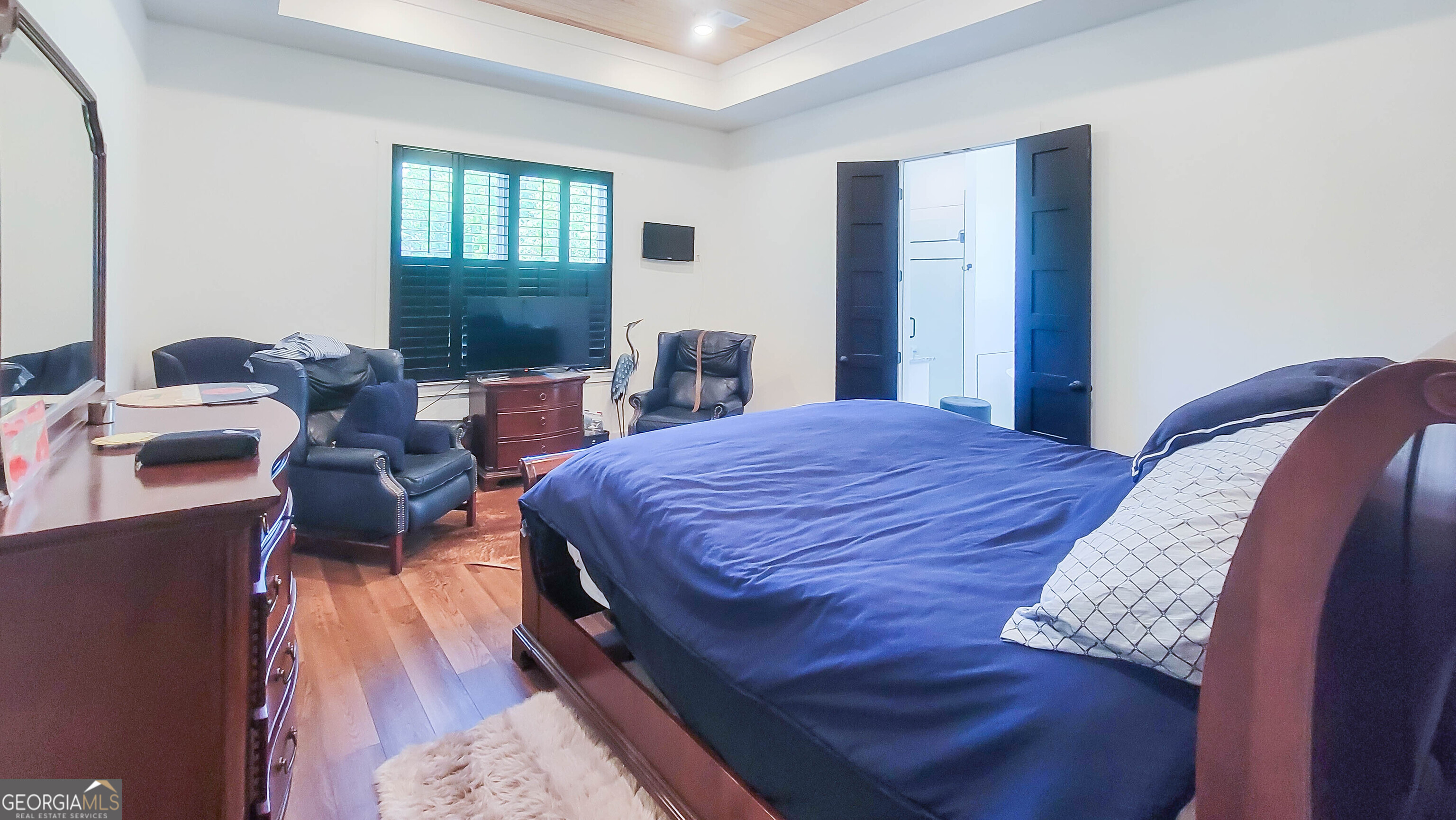 209 Lee Road Salem, AL 36874 - Photo 21 of 37 a bedroom with a bed and wooden floor