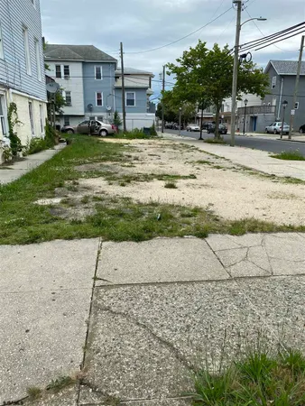a view of a yard with cars