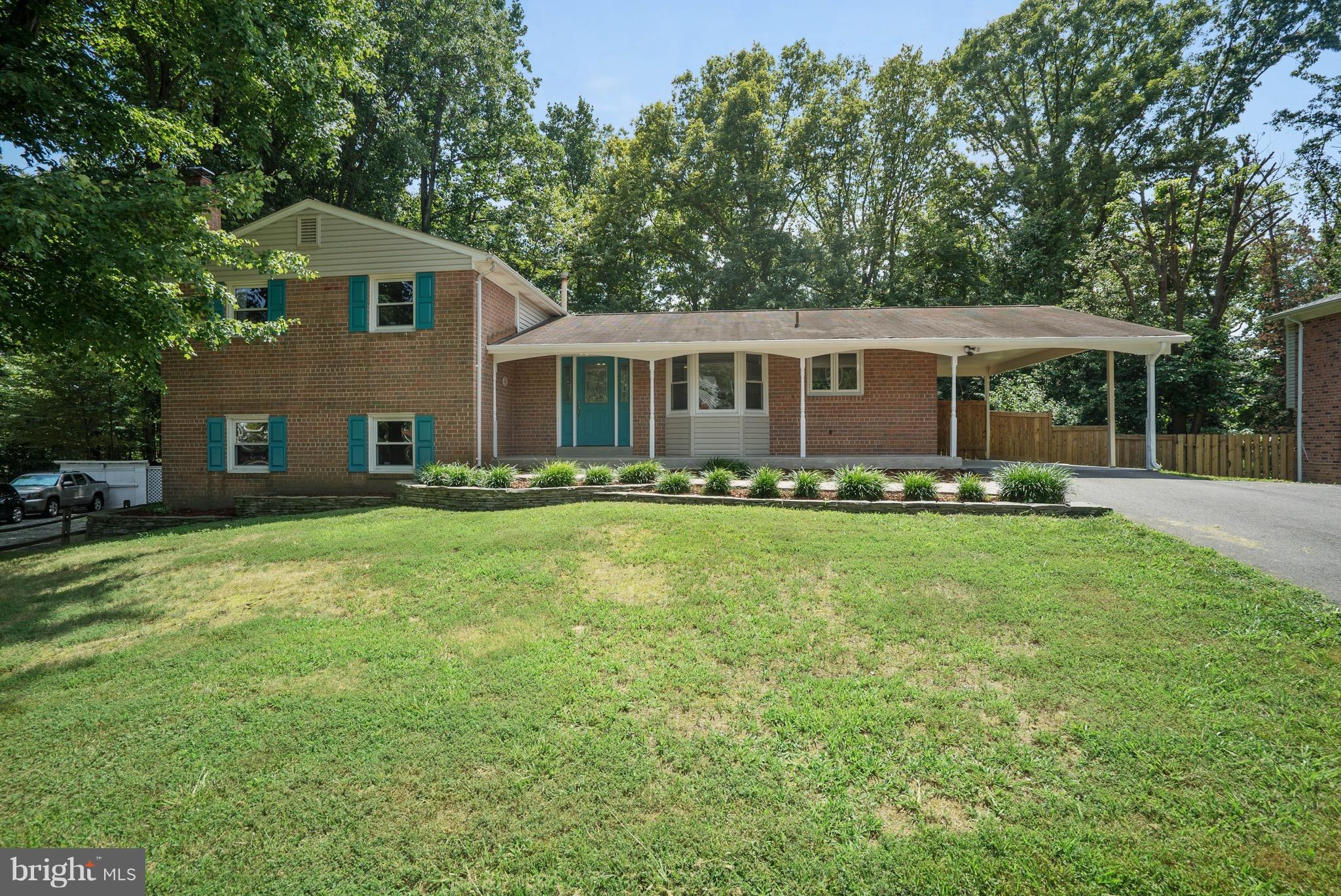 6928 Sydenstricker Road Springfield, VA 22153 - Photo 2 of 30 a front view of house with yard and green space