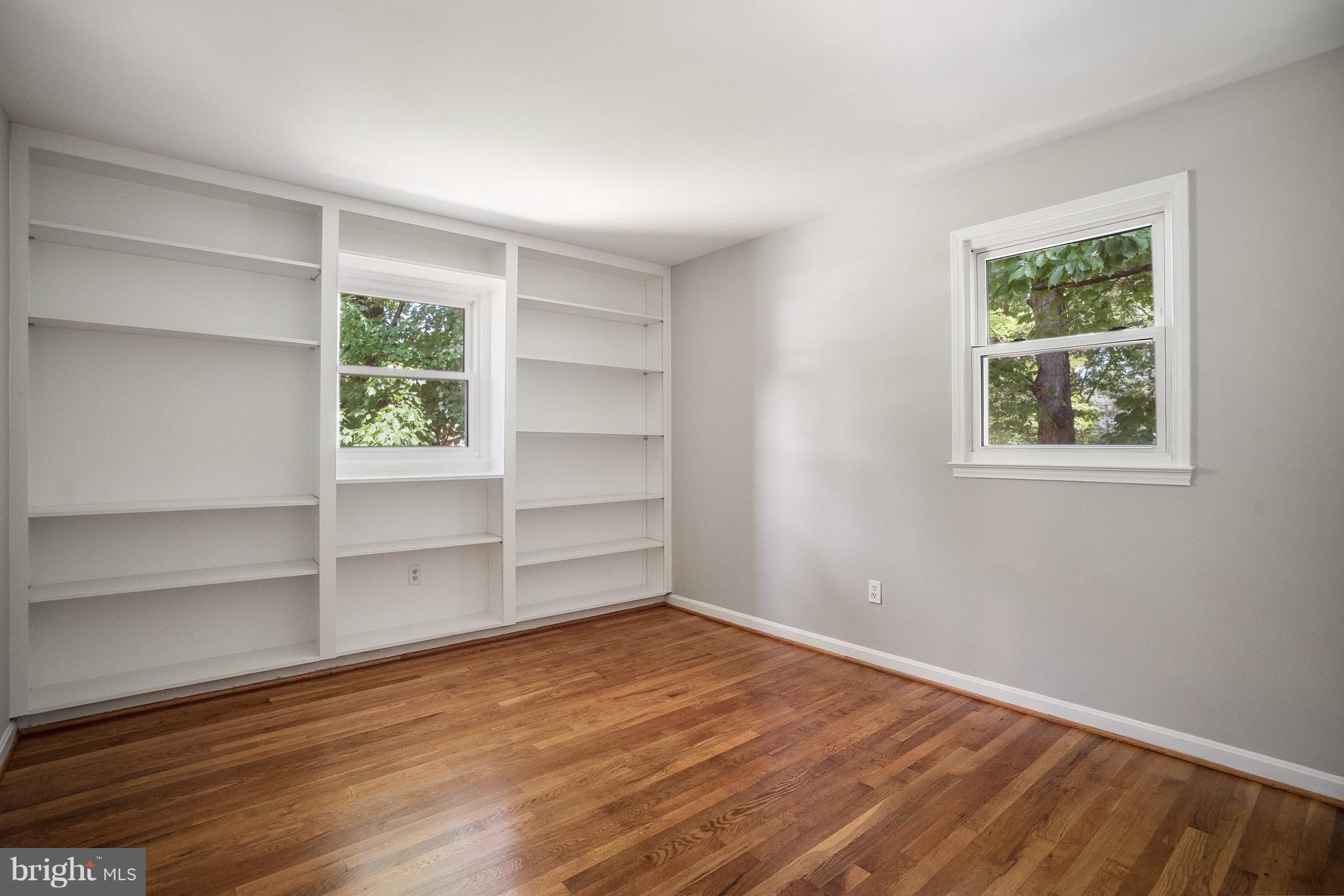 6928 Sydenstricker Road Springfield, VA 22153 - Photo 12 of 30 a view of a room with wooden floor and windows