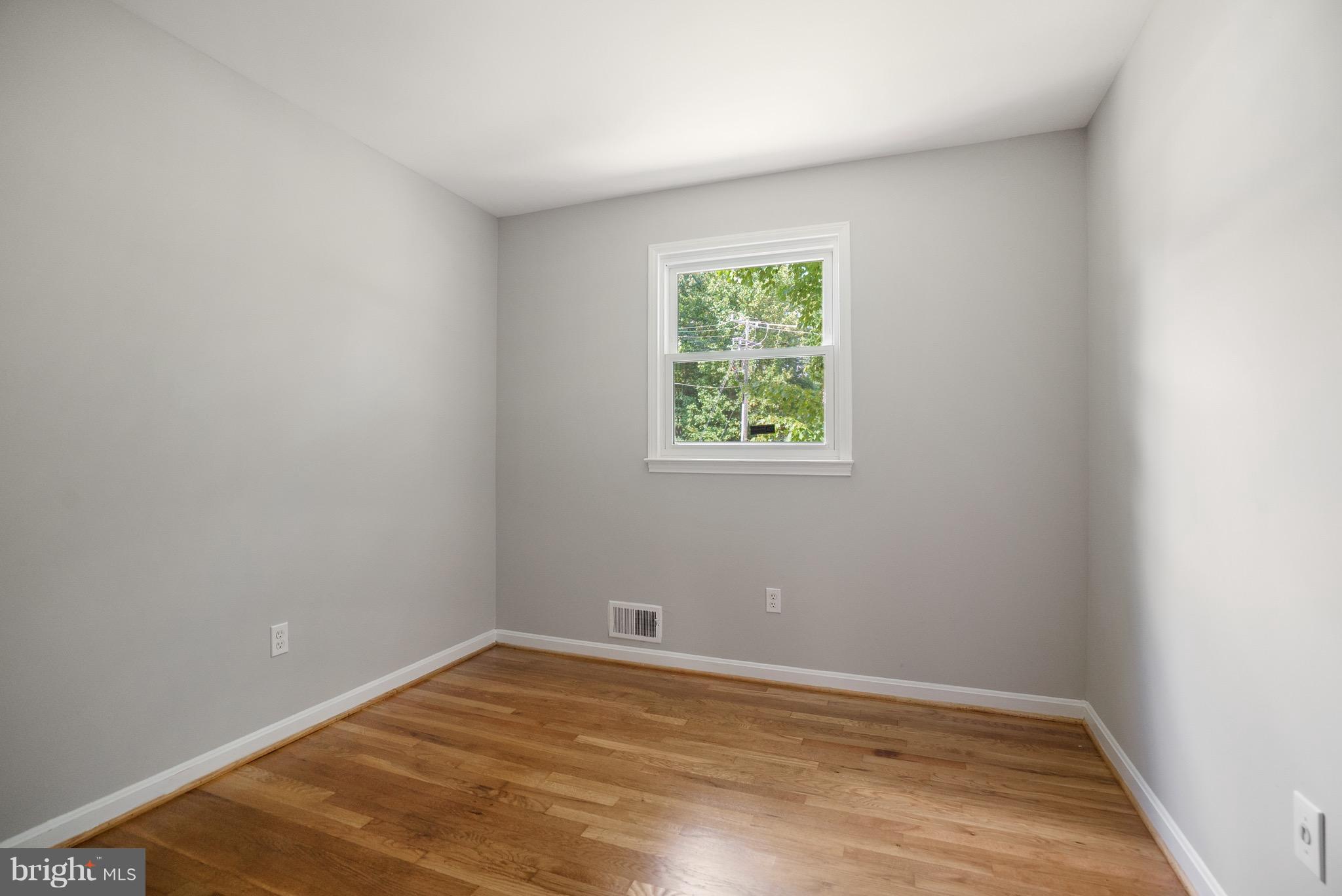 6928 Sydenstricker Road Springfield, VA 22153 - Photo 14 of 30 an empty room with a window