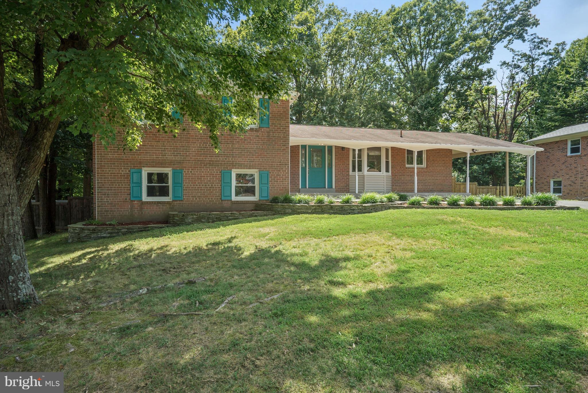 6928 Sydenstricker Road Springfield, VA 22153 - Photo 3 of 30 a front view of house with yard and green space