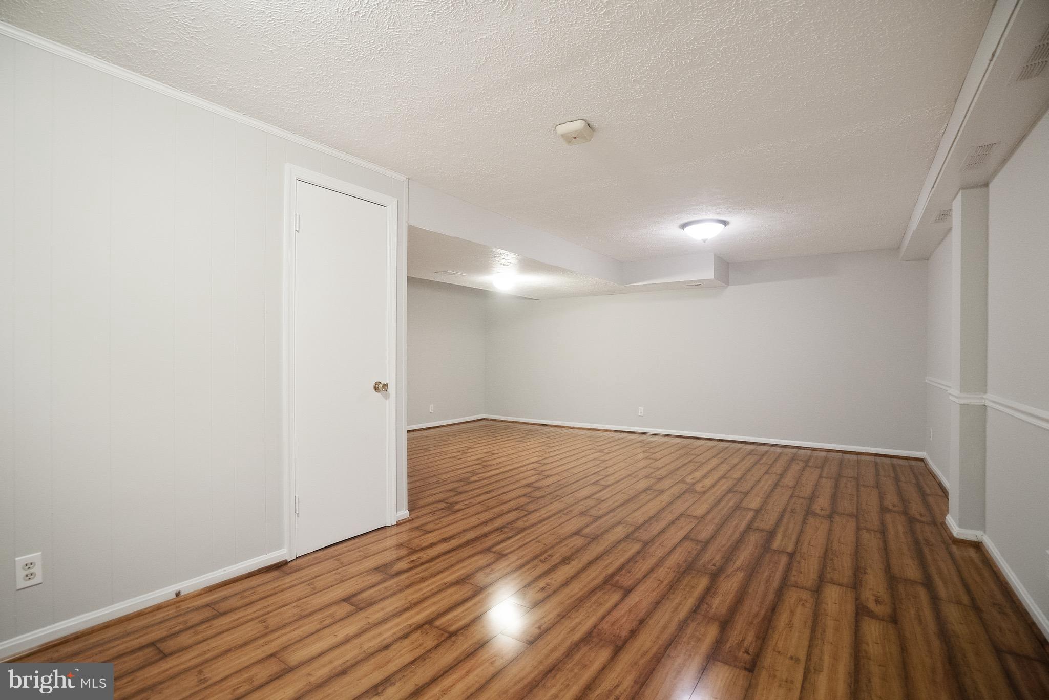 6928 Sydenstricker Road Springfield, VA 22153 - Photo 24 of 30 a view of a room with wooden floor
