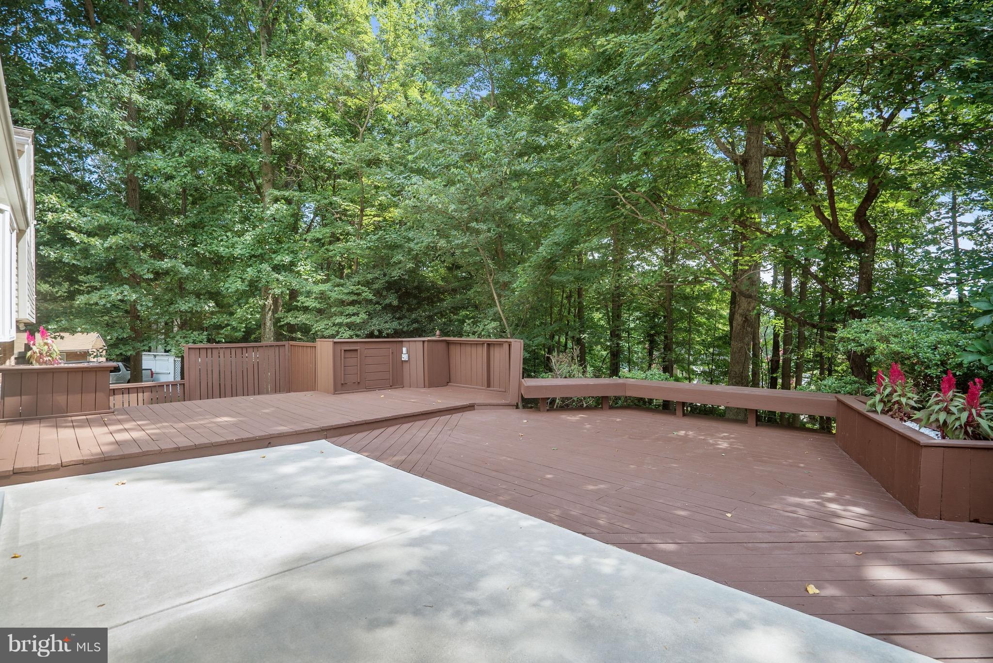6928 Sydenstricker Road Springfield, VA 22153 - Photo 26 of 30 a view of a backyard with plants and trees