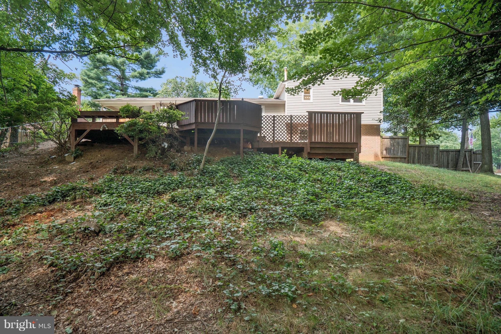 6928 Sydenstricker Road Springfield, VA 22153 - Photo 30 of 30 a backyard of a house with table and chairs
