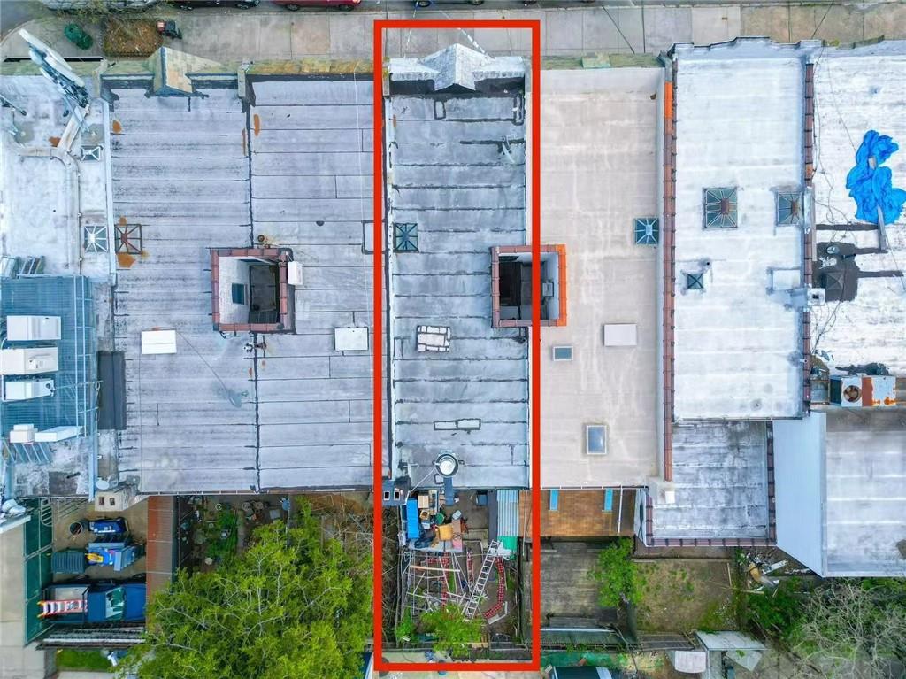 3617 Quentin Road Brooklyn, NY 11234 - Photo 2 of 2 aerial view of a brick building next to a yard
