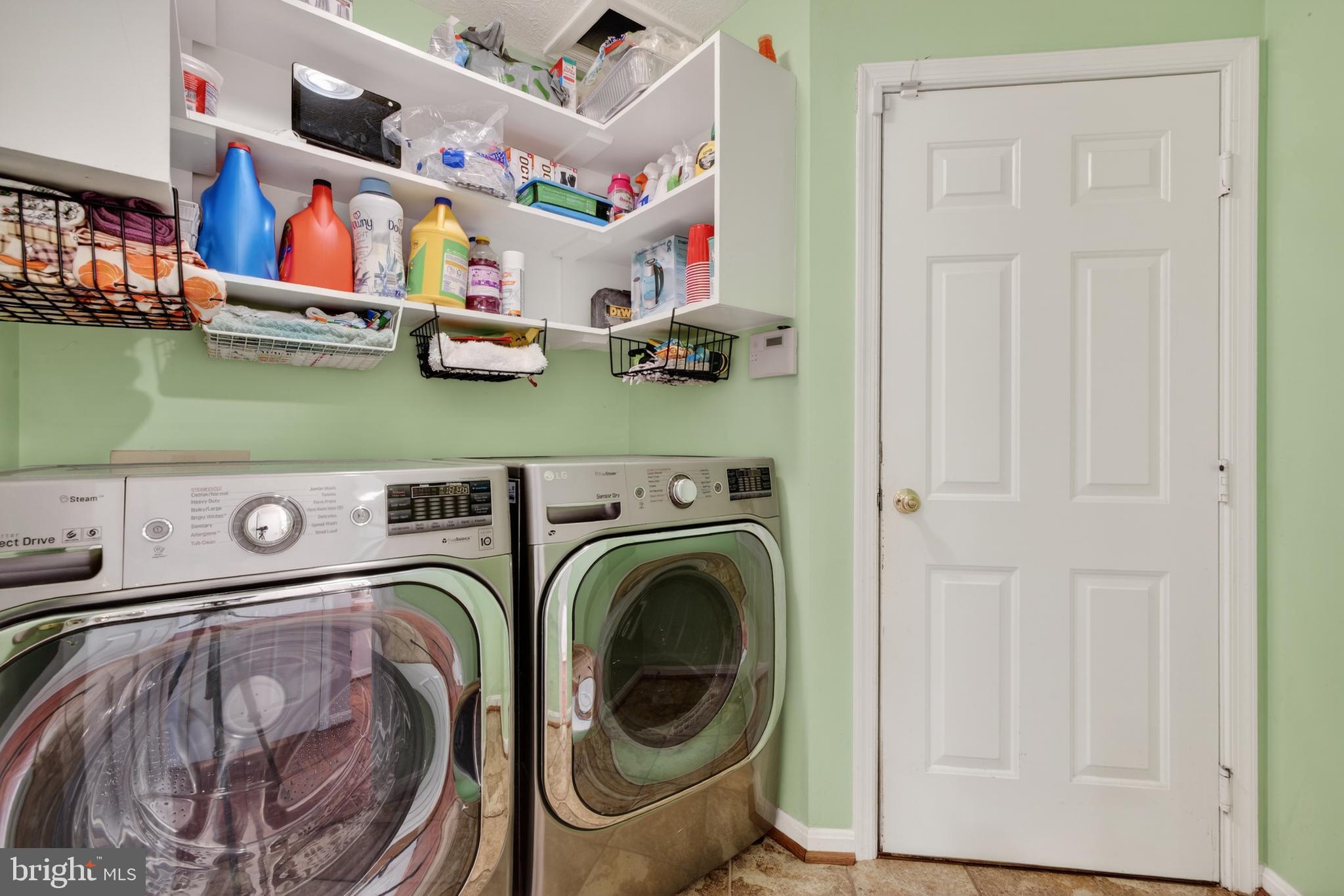 611 Hunting Ridge Drive Frederick, MD 21703 - Photo 23 of 50 a utility room with dryer and washer