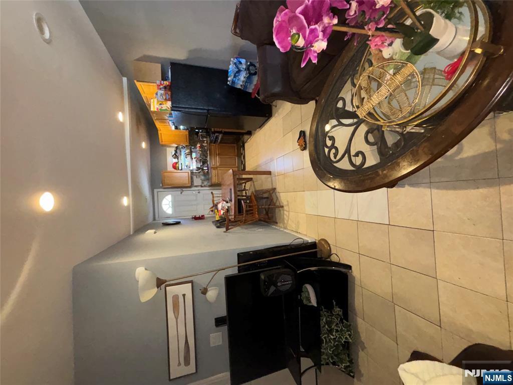 23 Oak Street Paterson, NJ 07501 - Photo 14 of 19 a kitchen with a stove and cabinets