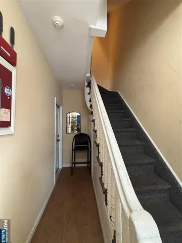 a view of a livingroom with furniture and stairs