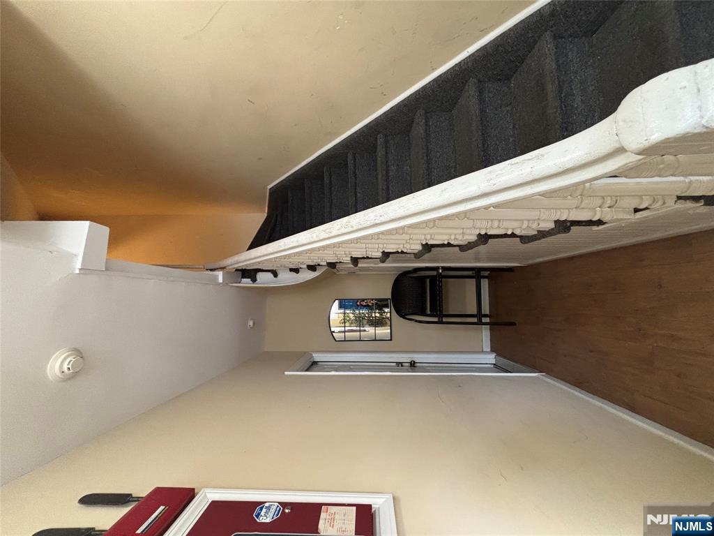 23 Oak Street Paterson, NJ 07501 - Photo 3 of 19 a view of a livingroom with furniture and stairs