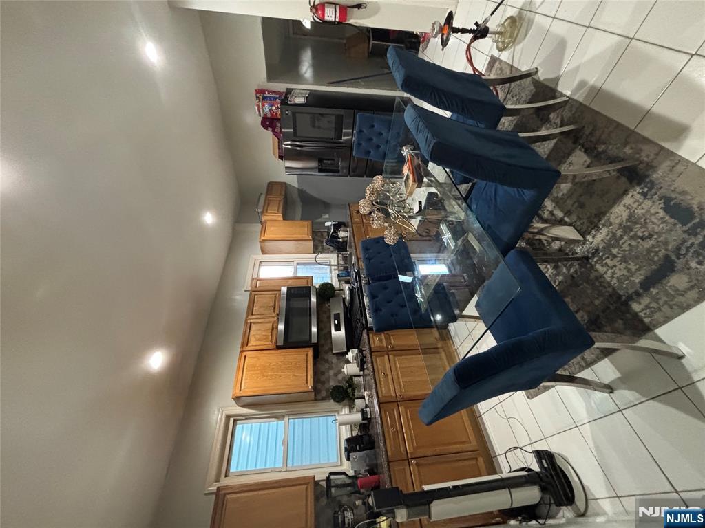 23 Oak Street Paterson, NJ 07501 - Photo 6 of 19 a view of a dining room with furniture