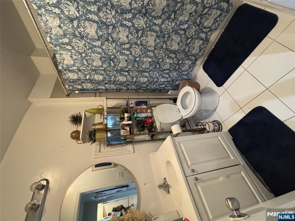 23 Oak Street Paterson, NJ 07501 - Photo 7 of 19 a utility room with dryer and washer