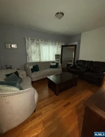 a kitchen with a sink a counter top space cabinets and stainless steel appliances