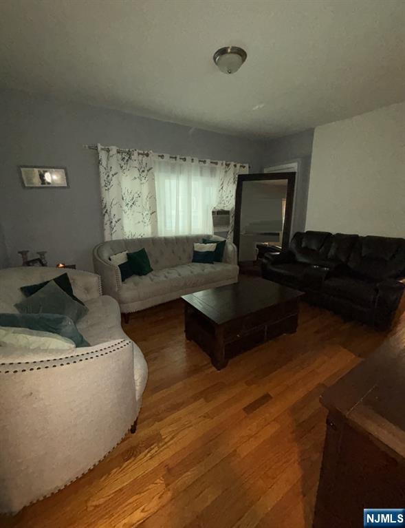 23 Oak Street Paterson, NJ 07501 - Photo 8 of 19 a living room with furniture and a large window