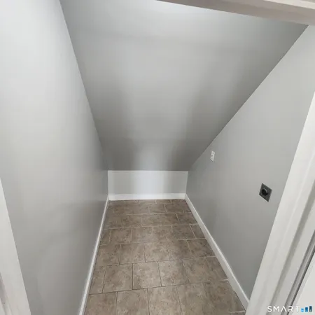 an entryway of a house with windows